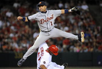 ANAHEIM, CA - AUGUST 25:  Placido Polanco #14 of the Detroit Tigers turns a double play on Howie Kendrick #47 of the Los Angeles Angels of Anaheim during the sixth inning at Angel Stadium of Anaheim on August 25, 2009 in Anaheim, California.  (Photo by Harry How/Getty Images)