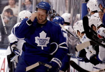 TORONTO - NOVEMBER 3:  Phil Kessel #81 of the Toronto Maple Leafs regroups after getting hit by Mattias Ohlund #5 of the Tampa Bay Lightning during a NHL game at the Air Canada Centre on November 3, 2009 in Toronto, Ontario, Canada .  (Photo by Abelimages/Getty Images)