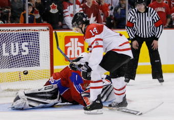 OTTAWA, ON - JANUARY 3:  Jordan Eberle #14 of Team Canada scores his shootout attempt on Vadim Zhelobnyuk #1 of Team Russia during the semifinals at the IIHF World Junior Championships at the Ottawa Civic Centre on January 03, 2009 in Ottawa, Ontario, Canada. Team Canada defeated Team Russia 6-5 in a shootout.  (Photo by Richard Wolowicz/Getty Images)