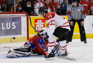 OTTAWA, ON - JANUARY 3:  Jordan Eberle #14 of Team Canada scores his shootout attempt on Vadim Zhelobnyuk #1 of Team Russia during the semifinals at the IIHF World Junior Championships at the Ottawa Civic Centre on January 03, 2009 in Ottawa, Ontario, Canada. Team Canada defeated Team Russia 6-5 in a shootout.  (Photo by Richard Wolowicz/Getty Images)