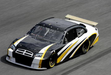 DAYTONA BEACH, FL - JANUARY 19:  NASCAR test driver Brett Bodine, drives the NASCAR car of tomorrow with a rear wing, during NASCAR Nextel Cup Series January Testing on January 19, 2006 at Daytona International Speedway in Daytona Beach, Florida.  (Photo by Rusty Jarrett/Getty Images)