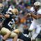SOUTH BEND, IN - OCTOBER 03: Chris Polk #1 of the Washington Huskies finds some running room as Kyle McCarthy #28  and Robert Blanton #12 of the Notre Dame Fighting Irish pursue on October 3, 2009 at Notre Dame Stadium in South Bend, Indiana. (Photo by Jonathan Daniel/Getty Images)