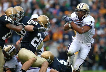 SOUTH BEND, IN - OCTOBER 03: Chris Polk #1 of the Washington Huskies finds some running room as Kyle McCarthy #28  and Robert Blanton #12 of the Notre Dame Fighting Irish pursue on October 3, 2009 at Notre Dame Stadium in South Bend, Indiana. (Photo by Jonathan Daniel/Getty Images)