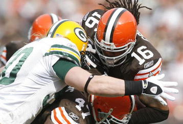 CLEVELAND, OH - OCTOBER 25:  Joshua Cribbs #16 of the Cleveland Browns is hit by A.J. Hawk #50 and Clay Matthews #52 of the Green Bay Packers at Cleveland Browns at Cleveland Browns Stadium on October 25, 2009 in Cleveland, Ohio.  (Photo by Matt Sullivan/Getty Images)