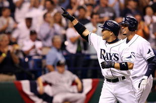 ST PETERSBURG, FL - OCTOBER 03:  Akinori Iwamura #1 of the Tampa Bay Rays celebrates with Jason Bartlett #8 after Iwamura's two run home run in the fifth inning against the Chicago White Sox in Game 2 of the American Leaugue Divisional Series at Tropicana Field on October 3, 2008 in St. Petersburg, Florida.  (Photo by Doug Benc/Getty Images)