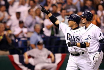 ST PETERSBURG, FL - OCTOBER 03:  Akinori Iwamura #1 of the Tampa Bay Rays celebrates with Jason Bartlett #8 after Iwamura's two run home run in the fifth inning against the Chicago White Sox in Game 2 of the American Leaugue Divisional Series at Tropicana Field on October 3, 2008 in St. Petersburg, Florida.  (Photo by Doug Benc/Getty Images)