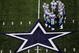 ARLINGTON, TX - NOVEMBER 01:  Quarterback Tony Romo #9 of the Dallas Cowboys huddles the offense during play against the Seattle Seahawks at Cowboys Stadium on November 1, 2009 in Arlington, Texas.  (Photo by Ronald Martinez/Getty Images)