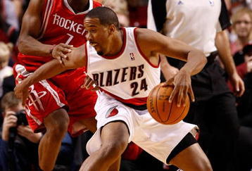 PORTLAND, OR - OCTOBER 27:  Kyle Lowry #7 of the Houston Rockets guards Andre Miller #24 of the Portland Trail Blazers during the season opener on October 27, 2009 at the Rose Garden in Portland, Oregon. NOTE TO USER: User expressly acknowledges and agrees that, by downloading and or using this Photograph, user is consenting to the terms and conditions of the Getty Images License Agreement.  (Photo by Jonathan Ferrey/Getty Images)