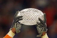 MIAMI - JANUARY 08:  Brandon Spikes #51 of the Florida Gators holds up the winning trophy after the FedEx BCS National Championship Game against the Oklahoma Sooners at Dolphin Stadium on January 8, 2009 in Miami, Florida.  (Photo by Eliot J. Schechter/Getty Images)