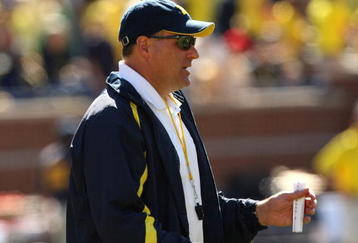 ANN ARBOR, MI - SEPTEMBER 19:  Head coach Rich Rodriguez of the Michigan Wolverines watches warmups before the game with the Eastern Michigan Eagles at Michigan Stadium on September 19, 2009 in Ann Arbor, Michigan.  Michigan won 45-17.  (Photo by Stephen Dunn/Getty Images)