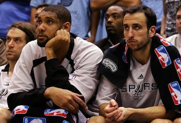 SALT LAKE CITY - MAY 26:  (L-R) Tim Duncan #21 and manu Ginobili #20 of the San Antonio Spurs react in the fourth quarter against the Utah Jazz in Game Three of the Western Conference Finals during the 2007 NBA Playoffs at the EnergySolutions Arena on May 26, 2007 in Salt Lake City, Utah. NOTE TO USER: User expressly acknowledges and agrees that, by downloading and/or using this Photograph, user is consenting to the terms and conditions of the Getty Images License Agreement.  (Photo by Lisa Blumenfeld/Getty Images)