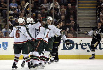 PITTSBURGH, PA - OCTOBER 31:  Eric Belanger #25 of the Minnesota Wild celebrates his goal with teammates in the first period against the Pittsburgh Penguins at Mellon Arena on October 31, 2009 in Pittsburgh, Pennsylvania.  (Photo by Justin K. Aller/Getty Images)