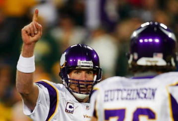 GREEN BAY, WI - NOVEMBER 01: Quarterback Brett Favre #4 of the Minnesota Vikings celebrates a touchdown by teammate Percy Harvin #12 after a 51 yard touchdown pass during the third quarter of the game against the Green Bay Packers at Lambeau Field on November 1, 2009 in Green Bay, Wisconsin. (Photo by Scott Boehm/Getty Images)