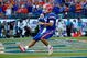 JACKSONVILLE, FL - OCTOBER 31:  Quarterback Tim Tebow #15 of the Florida Gators rushes in for a touchdown against the Georgia Bulldogs at Jacksonville Municipal Stadium on October 31, 2009 in Jacksonville, Florida.  (Photo by Kevin C. Cox/Getty Images)