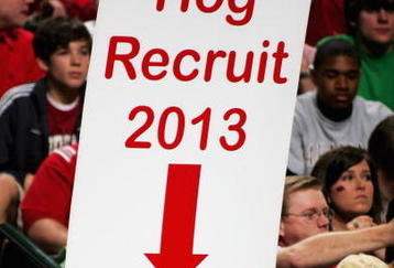 DALLAS, TEXAS - MARCH 17:  A young Arkansas Razorbacks fan holds a sign up during the game against Bucknell Bison in the First Round of the 2006 NCAA Division 1 Men's Basketball Championship Tournament on March 17, 2006 at the American Airlines Center in Dallas, Texas.  (Photo by Ronald Martinez/Getty Images)