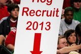 DALLAS, TEXAS - MARCH 17:  A young Arkansas Razorbacks fan holds a sign up during the game against Bucknell Bison in the First Round of the 2006 NCAA Division 1 Men's Basketball Championship Tournament on March 17, 2006 at the American Airlines Center in Dallas, Texas.  (Photo by Ronald Martinez/Getty Images)