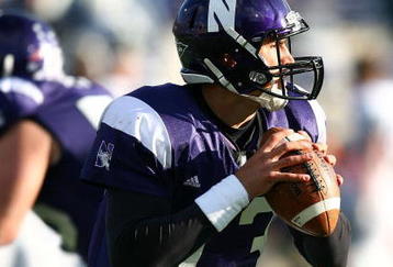 EVANSTON, IL - OCTOBER 31: Mike Kafka #13 of the Northwestern Wildcats looks for a receiver against the Penn State Nittany Lions at Ryan Field on October 31, 2009 in Evanston, Illinois. Penn State defeated Northwestern 34-13. (Photo by Jonathan Daniel/Getty Images)