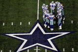 ARLINGTON, TX - NOVEMBER 01:  Quarterback Tony Romo #9 of the Dallas Cowboys huddles the offense during play against the Seattle Seahawks at Cowboys Stadium on November 1, 2009 in Arlington, Texas.  (Photo by Ronald Martinez/Getty Images)