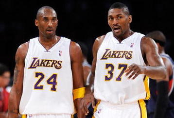 LOS ANGELES, CA - NOVEMBER 01:  Kobe Bryant #24 and Ron Artest of the Los Angeles Lakers talk against the Atlanta Hawks during the second quarter of the NBA basketball game at Staples Center on November 1, 2009 in Los Angeles, California. Bryant scored 41 points and the Lakers went on to win 118-110. NOTE TO USER: User expressly acknowledges and agrees that, by downloading and/or using this Photograph, user is consenting to the terms and conditions of the Getty Images License Agreement.  (Photo by Kevork Djansezian/Getty Images)