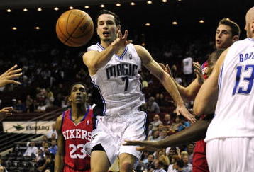 ORLANDO, FL - OCTOBER 28:  J.J. Redick #7 of the Orlando Magic passes the ball during the game against the Philadelphia 76ers on October 28, 2009 at Amway Arena in Orlando, Florida.  NOTE TO USER: User expressly acknowledges and agrees that, by downloading and/or using this Photograph, user is consenting to the terms and conditions of the Getty Images License Agreement.  (Photo by Sam Greenwood/Getty Images)