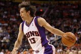 PHOENIX - OCTOBER 30:  Steve Nash #13 of the Phoenix Suns handles the ball during the NBA game against the Golden State Warriors at US Airways Center on October 30, 2009 in Phoenix, Arizona.  The Suns defeated the Warriors 123-101.   NOTE TO USER: User expressly acknowledges and agrees that, by downloading and or using this photograph, User is consenting to the terms and conditions of the Getty Images License Agreement.  (Photo by Christian Petersen/Getty Images)