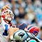CHARLOTTE, NC - OCTOBER 25:  Ryan Fitzpatrick #14 of the Buffalo Bills throws under pressure from Gary Barnidge #82 of the Carolina Panthers  during the first quarter at Bank of America Stadium on October 25, 2009 in Charlotte, North Carolina.  (Photo by Grant Halverson/Getty Images)