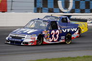 INDIANAPOLIS, IN - JULY 25:  Ron Hornaday Jr driver of the #33 VFW Chevrolet races with Bobby East driver of the #09 Zaxby's Ford during the NASCAR Craftsman Truck Series Power Stroke Diesel 200 at O'Reilly Raceway Park on July 25, 2008 in Indianapolis, Indiana.  (Photo by John Harrelson/Getty Images for NASCAR)