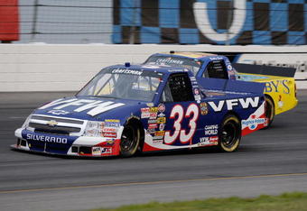 INDIANAPOLIS, IN - JULY 25:  Ron Hornaday Jr driver of the #33 VFW Chevrolet races with Bobby East driver of the #09 Zaxby's Ford during the NASCAR Craftsman Truck Series Power Stroke Diesel 200 at O'Reilly Raceway Park on July 25, 2008 in Indianapolis, Indiana.  (Photo by John Harrelson/Getty Images for NASCAR)