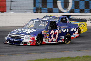 INDIANAPOLIS, IN - JULY 25:  Ron Hornaday Jr driver of the #33 VFW Chevrolet races with Bobby East driver of the #09 Zaxby's Ford during the NASCAR Craftsman Truck Series Power Stroke Diesel 200 at O'Reilly Raceway Park on July 25, 2008 in Indianapolis, Indiana.  (Photo by John Harrelson/Getty Images for NASCAR)