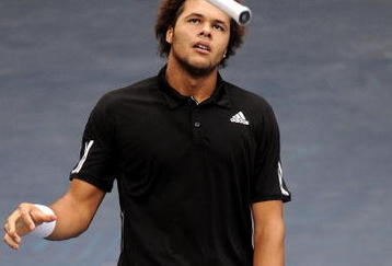 VALENCIA, SPAIN - NOVEMBER 04:  Jo-Wilfried Tsonga of France juggles his racket in first round match against Mikhail Youzhny of Russia during the ATP 500 World Tour Valencia Open tennis tournament at the Ciudad de las Artes y las Ciencias on November 4, 2009 in Valencia, Spain. Tsjonga abandoned the match due to an injury.  (Photo by Jasper Juinen/Getty Images)