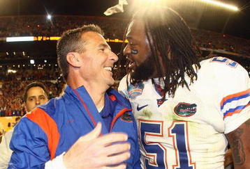 MIAMI - JANUARY 08:  Head coach Urban Meyer of the Florida Gators celebrates with Brandon Spikes #51 their win over the Oklahoma Sooners after the FedEx BCS National Championship Game at Dolphin Stadium on January 8, 2009 in Miami, Florida.  (Photo by Donald Miralle/Getty Images)