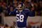 EAST RUTHERFORD, NJ - OCTOBER 25:  Antonio Pierce #58 of the New York Giants gets the crowd going against the Arizona Cardinals on October 25, 2009 at Giants Stadium in East Rutherford, New Jersey.  (Photo by Jared Wickerham/Getty Images)