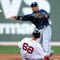 BOSTON - SEPTEMBER 13:  Akinori Iwamura #1 of the Tampa Bay Rays sends the ball to first as Josh Reddick #68 of the Boston Red Sox is out at second on September 13, 2009 at Fenway Park in Boston, Massachusetts.  (Photo by Elsa/Getty Images)
