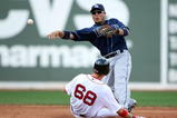 BOSTON - SEPTEMBER 13:  Akinori Iwamura #1 of the Tampa Bay Rays sends the ball to first as Josh Reddick #68 of the Boston Red Sox is out at second on September 13, 2009 at Fenway Park in Boston, Massachusetts.  (Photo by Elsa/Getty Images)