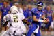 BOISE, ID - SEPTEMBER 3:  Kellen Moore #11 of the Boise State throws a pass under pressure by T.J. Ward #2 of the Oregon Ducks in second quarter of the game on September 3, 2009 at Broncos Stadium in Boise, Idaho. Boise State won the game 19-8. (Photo by Steve Dykes/Getty Images)