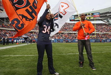 CHICAGO - NOVEMBER 01: Brittany and Jarrett Payton, daughter and son of Chicago Bears player Walter Payton, participate in pre-game ceremonies on the 10th anniversary of their father's death before a game between the Bears and the Cleveland Browns at Soldier Field on November 1, 2009 in Chicago, Illinois. The Bears defeated the Browns 30-6. (Photo by Jonathan Daniel/Getty Images)