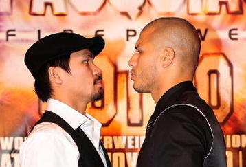 BEVERLY HILLS, CA - SEPTEMBER 14:  Manny Pacquiao and  Miguel Cotto pose for pictures during the press conference at the Beverly Hills Hotel on September 14, 2009 in Beverly Hills, California.  (Photo by Jacob de Golish/Getty Images)