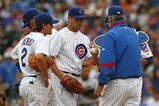 CHICAGO - AUGUST 28: Starting pitcher Ted Lilly #30 of the Chicago Cubs is taken out of a game against the New York Mets by manager Lou Piniella #41 as Ryan Theriot #2 watches on August 28, 2009 at Wrigley Field in Chicago, Illinois. The Cubs defeated the Mets 5-2. (Photo by Jonathan Daniel/Getty Images) 