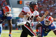 JACKSONVILLE, FL - OCTOBER 31: Brandon Spikes #51 and Ryan Stamper #41 of the Florida Gators chase after quarterback Joe Cox #14 of the Georgia Bulldogs at Jacksonville Municipal Stadium on October 31, 2009 in Jacksonville, Florida. (Photo by Kevin C. Cox/Getty Images)
