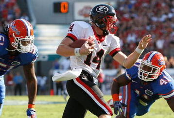 JACKSONVILLE, FL - OCTOBER 31:  Brandon Spikes #51 and Ryan Stamper #41 of the Florida Gators chase after quarterback Joe Cox #14 of the Georgia Bulldogs at Jacksonville Municipal Stadium on October 31, 2009 in Jacksonville, Florida.  (Photo by Kevin C. Cox/Getty Images)
