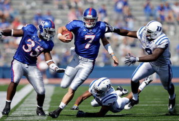 LAWRENCE, KS - SEPTEMBER 19:  Quarterback Kale Pick #7 of the Kansas Jayhawks carries the ball upfield  during the game against the Duke Blue Devils on Kivisto Field at Memorial Stadium on September 19, 2009 in Lawrence, Kansas.  (Photo by Jamie Squire/Getty Images)
