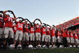 COLUMBUS, OH - OCTOBER 10:  The Ohio State Buckeyes sing their alma mater, Carmen Ohio, after defeating the Wisconsin Badgers 31-13 at Ohio Stadium on October 10, 2009 in Columbus, Ohio.  (Photo by Jamie Sabau/Getty Images)
