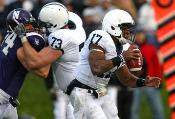 EVANSTON, IL - OCTOBER 31: Daryll Clark #17 of the Penn State Nittany Lions runs with the ball as teammate Dennis Landolt #73 blocks Vince Browne #94 of the Northwestern Wildcats at Ryan Field on October 31, 2009 in Evanston, Illinois. Penn State defeated Northwestern 34-13. (Photo by Jonathan Daniel/Getty Images)