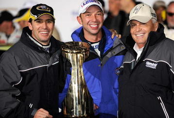 CONCORD, NC - OCTOBER 17:  (L-R) Jimmie Johnson, driver of the #48 Lowe's Chevrolet, celebrates with his crew chief Chad Knaus and team owner Rick Hendrick after winning the NASCAR Sprint Cup Series NASCAR Banking 500 at Lowe's Motor Speedway on October 17, 2009 in Concord, North Carolina.  (Photo by Rusty Jarrett/Getty Images for NASCAR)