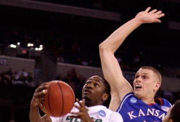 INDIANAPOLIS - MARCH 27:  Kalin Lucas #1 of the Michigan State Spartans drives for a shot attempt against Cole Aldrich #45 of the Kansas Jayhawks during the third round of the NCAA Division I Men's Basketball Tournament at the Lucas Oil Stadium on March 27, 2009 in Indianapolis, Indiana.  (Photo by Andy Lyons/Getty Images)
