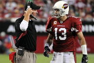 GLENDALE, AZ - SEPTEMBER 27: Kurt Warner #13 of the Arizona Cardinals talks to Ken Whisenhunt after a timeout against the Indianapolis Colts during the game at University of Phoenix Stadium on September 27, 2009 in Glendale, Arizona. (Photo by Harry How/Getty Images)