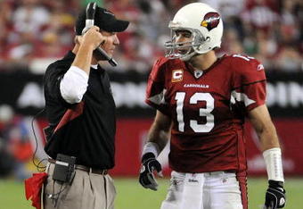 GLENDALE, AZ - SEPTEMBER 27:  Kurt Warner #13 of the Arizona Cardinals talks to Ken Whisenhunt after a timeout against the Indianapolis Colts during the game at University of Phoenix Stadium on September 27, 2009 in Glendale, Arizona.  (Photo by Harry How/Getty Images)
