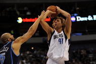 DALLAS - NOVEMBER 03:  Forward Dirk Nowitzki #41 of the Dallas Mavericks takes a shot against Carlos Boozer #5 of the Utah Jazz on November 3, 2009 at American Airlines Center in Dallas, Texas.  NOTE TO USER: User expressly acknowledges and agrees that, by downloading and/or using this Photograph, user is consenting to the terms and conditions of the Getty Images License Agreement.  (Photo by Ronald Martinez/Getty Images)