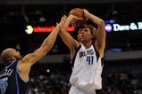 DALLAS - NOVEMBER 03:  Forward Dirk Nowitzki #41 of the Dallas Mavericks takes a shot against Carlos Boozer #5 of the Utah Jazz on November 3, 2009 at American Airlines Center in Dallas, Texas.  NOTE TO USER: User expressly acknowledges and agrees that, by downloading and/or using this Photograph, user is consenting to the terms and conditions of the Getty Images License Agreement.  (Photo by Ronald Martinez/Getty Images)