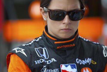 SPARTA, KY - JULY 31:  Danica Patrick driver of the #7 Boost Mobile/Motorola Andretti Green Racing Dallara Honda during a delay in practice for the IRL IndyCar Series Meijer Indy 300 on July 31, 2009 at the Kentucky Speedway in Sparta, Kentucky.  (Photo by Robert Laberge/Getty Images)